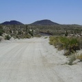 Riding south from Tank 3 on Aiken Mine Road, the road is slightly sandy with occasional volcanic debris