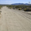 I often find myself riding in the furthest-left tire track on the road to avoid the bumpy washboard surface
