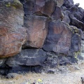 A faint hum oozes out of the lava, and it's not the spirit of the rock art whispering at me through the silence