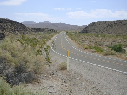 I remount the 10-ton bike and continue my trek up Kelbaker Road as it winds around the edge of lava flows