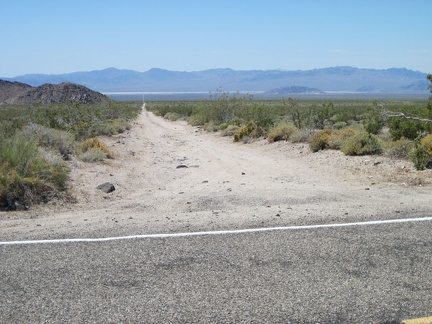 A while after my break at Kelbaker Road's 10-mile curve, I pause as I pass the dirt road that leads down to 17-Mile Point