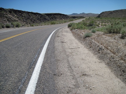 One of my favorite moments of riding up Kelbaker Road is when I reach the edge of the lava, at left, about 13 miles out of Baker