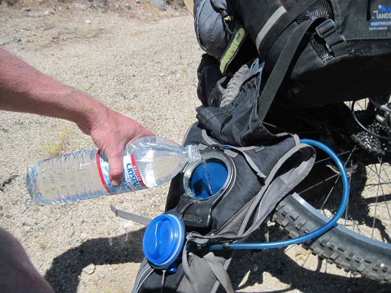 A bit further up Kelbaker Road, I stop again to refill my Camelbak, which has run dry again; any excuse for a break is good