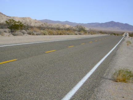 I'm getting close to &quot;10-mile bend&quot; on Kelbaker Road, where the road turns sharply right after the little dip ahead