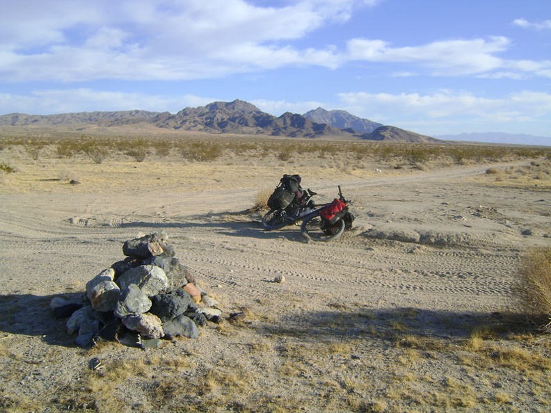 After 5 miles of dirt road and Mojave Road, I take an energy-bar break at the junction of the Old Kelso Road