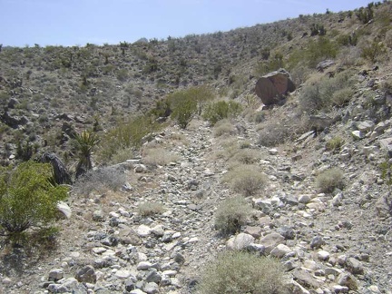 The steepest part of the climb is over for now and the old road switchbacks gently around the crest of the hill on a ledge