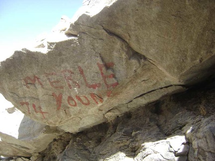 A rock at the entrance to the mine is painted with "Merle Young 74"