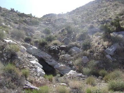 I see the remains of something up on the hill above the tunnel, perhaps an old roof