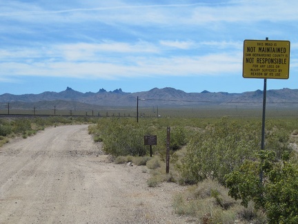 The day's travels begin as I ride south on Nipton-Moore Road, a dirt road that hugs the Ivanpah Valley train tracks for miles