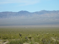 To the west, down in Ivanpah Valley, sits reclusively a lone habitation