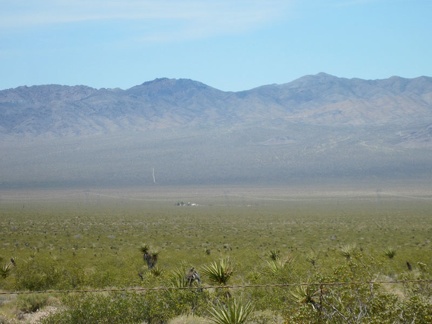 To the west, down in Ivanpah Valley, sits reclusively a lone habitation
