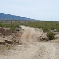 Nipton-Moore Road is mostly straight and almost flat, but it occasionally dips down to cross drainage washes