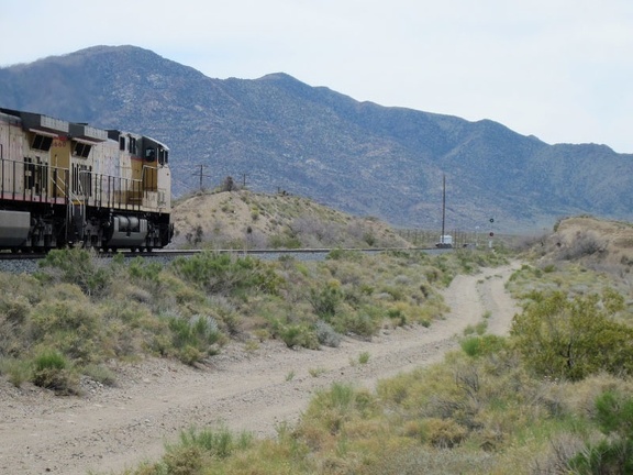Another freight train passes by as I ride up Nipton-Moore Road, Mojave National Preserve
