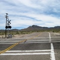 I've reached the pavement of Ivanpah Road, cross the tracks, then ride over to the abandoned house nearby