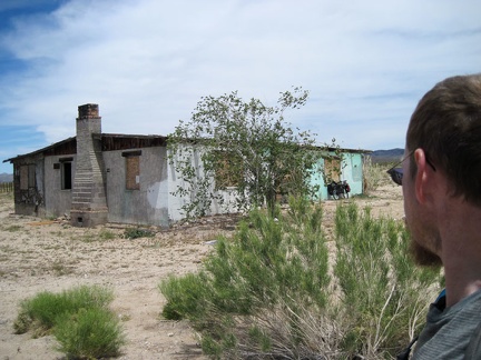 I park the 10-ton bike against the old house on Ivanpah Road and go for a walk around the property