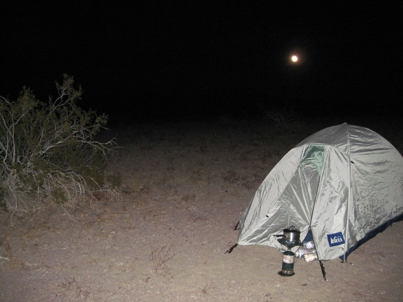 After dark, the moon rises in the background and I boil water for tonight's add-water-to-bag meal