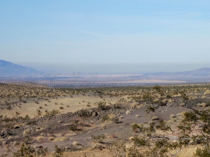 From my campsite on the Sleeping Beauty foothills, I can zoom in on a long freight train down by the freeway