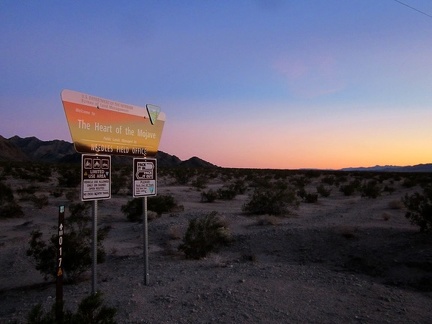 As the sun disappears, I ride past another BLM Heart-of-Mojave sign at the junction of Crucero Road and the Cady Mtns powerline