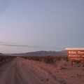 I pass the Kelso Dunes Wilderness sign at dusk, enjoying the views toward the Bristol Mountains, where I hiked yesterday