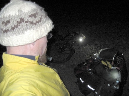 My flashlight and bicycle light headlight assist me in setting up camp in the dark valley; the almost-full moon hasn't risen yet