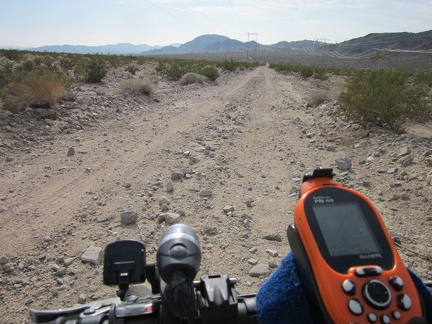 First, I ride down the bumpy powerline road 1.7 miles back to Crucero Road