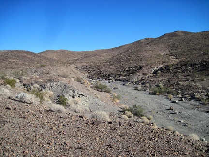 The dry stream that feeds the dry natural tank looks benign, despite the deep erosion that I just saw downstream