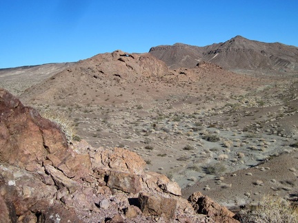 I turn around and realize that I'm looking at the Broadwell Natural Arch, so I climb a rocky outcrop to get a better view