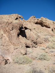 The Broadwell Natural Arch formation is full of eroded little caves in the rock
