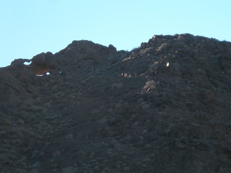 On the north side of the Broadwell Natural Arch formation, I notice a few holes in the rock that I didn't see earlier