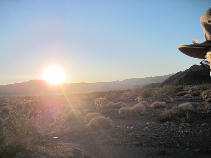 The cold sun starts to set behind the Cady Mountains on the far side of Broadwell Dry Lake