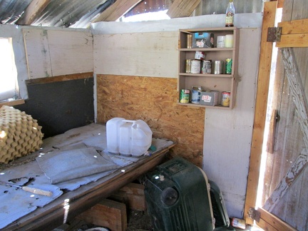 A platform for sleeping and a shelf for food