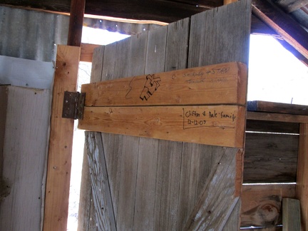 A couple of signatures adorn the inside of the door