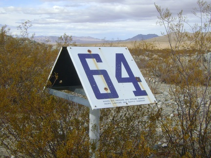 This road also serves as access to a gas pipeline, as evidenced by &quot;marker 64&quot; here