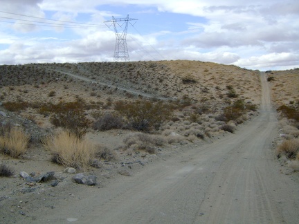 The power-line road heads straight up a really steep grade ahead, but a detour to the left offers an easier way over the hill