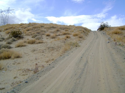 The short, sandy hill on the power-line road is really steep, rising at about 15% grade, with poor traction