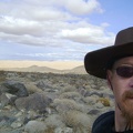Now that I'm about 1.25 miles up the rocky fan and 300 feet higher, the Kelso Dunes create a contrasty backdrop behind me