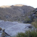 I climb over a granite platform as I head further up Bull Canyon