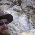 I take an energy-bar break up on a rock pile overlooking the Bull Canyon dry waterfall, at about 3450 feet elevation