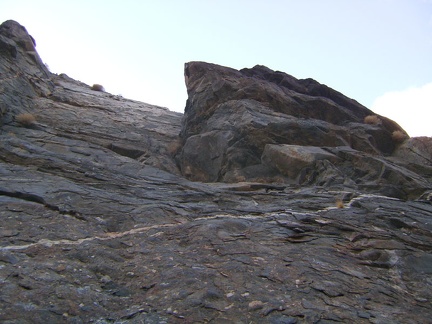 Up above me in the rock wall at my left is a protruding rock structure