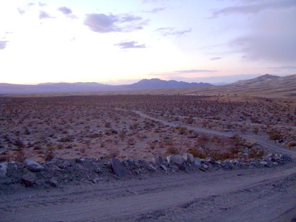 I catch the last vestiges of sunlight as I walk the final 1.3 miles down the power-line road back to camp