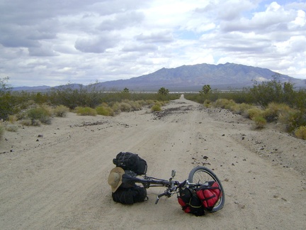 I stop briefly to take in the views of the Clark Mountain Range behind me, where I camped the last three nights