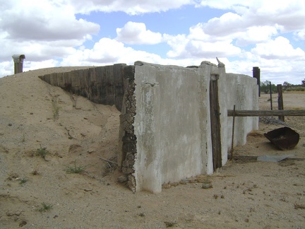 A closer view of the dugout reveals that its front wall is not concrete after all, but built of timbers covered in stucco