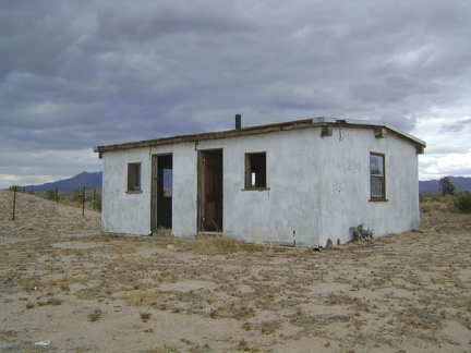 A relatively modern two-unit building sits at Rock Tank