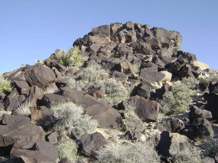 Approaching the base of the lava flow from the knoll that it rests on