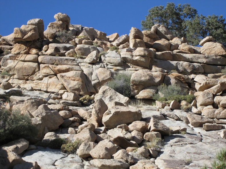 Rock piles along the wash attract my attention