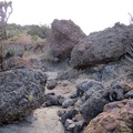  I walk up a boulder-strewn drainage area toward that pass in the Castle Peaks