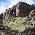 I notice a natural arch in the Castle Peaks pinnacles as I start my way down the hill