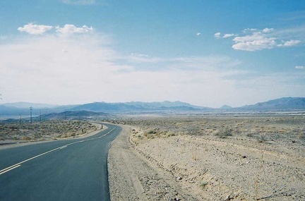 Near the crest of China Ranch Road, I chat with another bicyclist before heading down to Tecopa Hot Springs to end the day