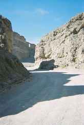 I walk back to the China Ranch store, rest briefly, drink two cans of cold Coca-cola, and begin the ride up out of the canyon