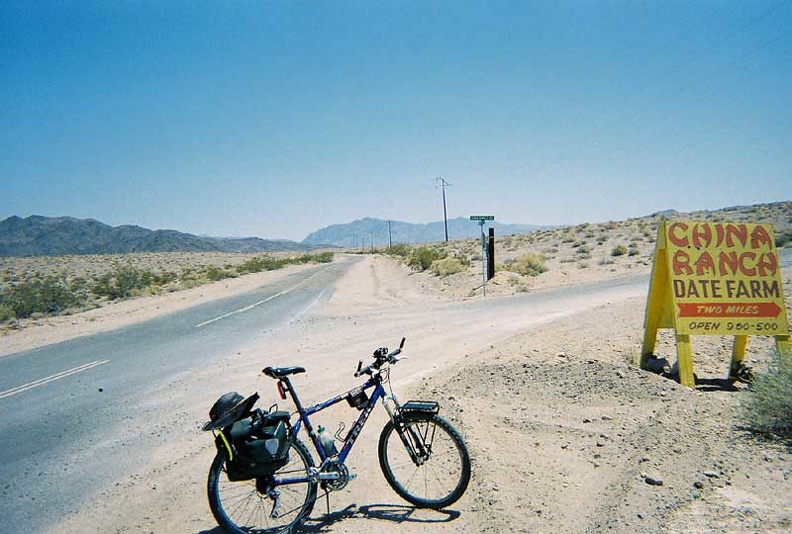 I ride up the Old Spanish Trail Highway's gentle hill, which leads out of Tecopa toward the Kingston Range